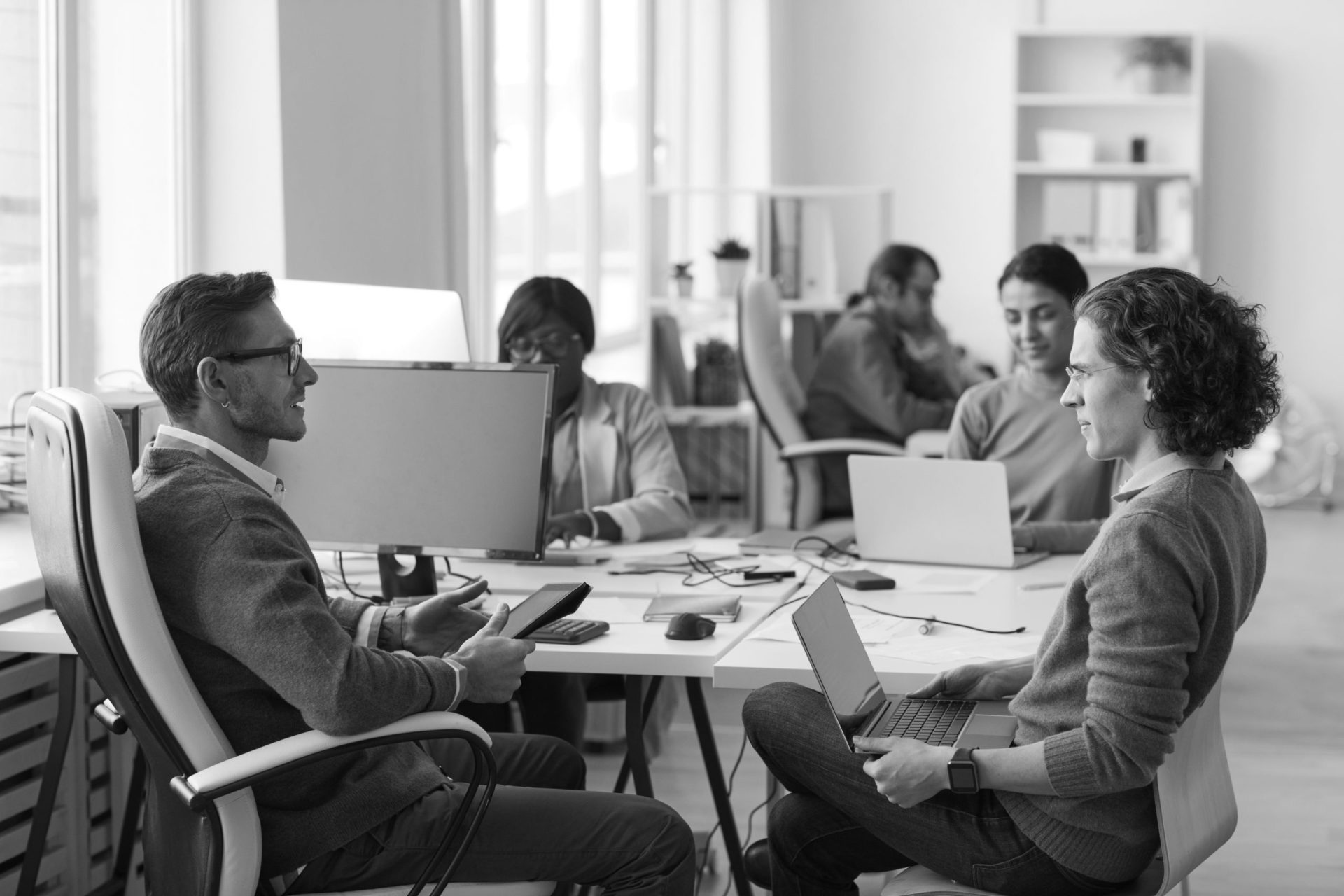 Male Business Manager Talking to Employee