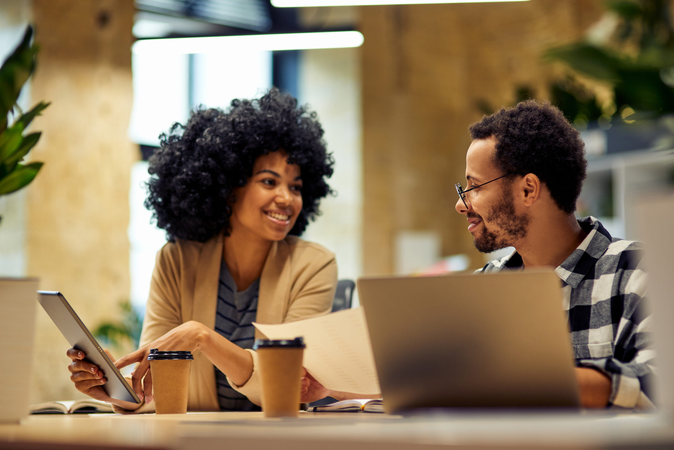 Sharing,Fresh,Ideas.,Two,Young,Happy,Multiracial,Business,People,Sitting Sharing,Fresh,Ideas.,Two,Young,Happy,Multiracial,Business,People,Sitting